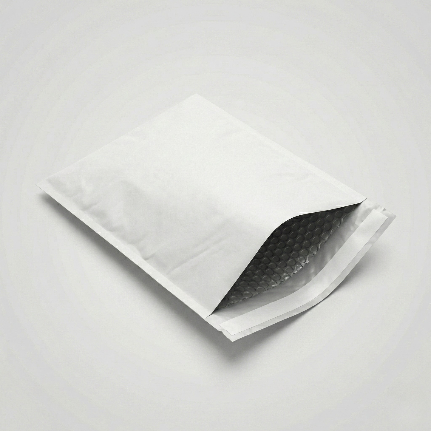 White bubble mailer on a light gray background